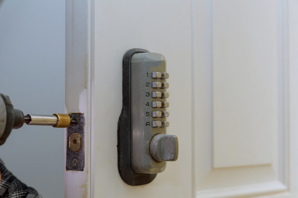 Electronic door handle installed on wood door with digital door lock systems security protection for